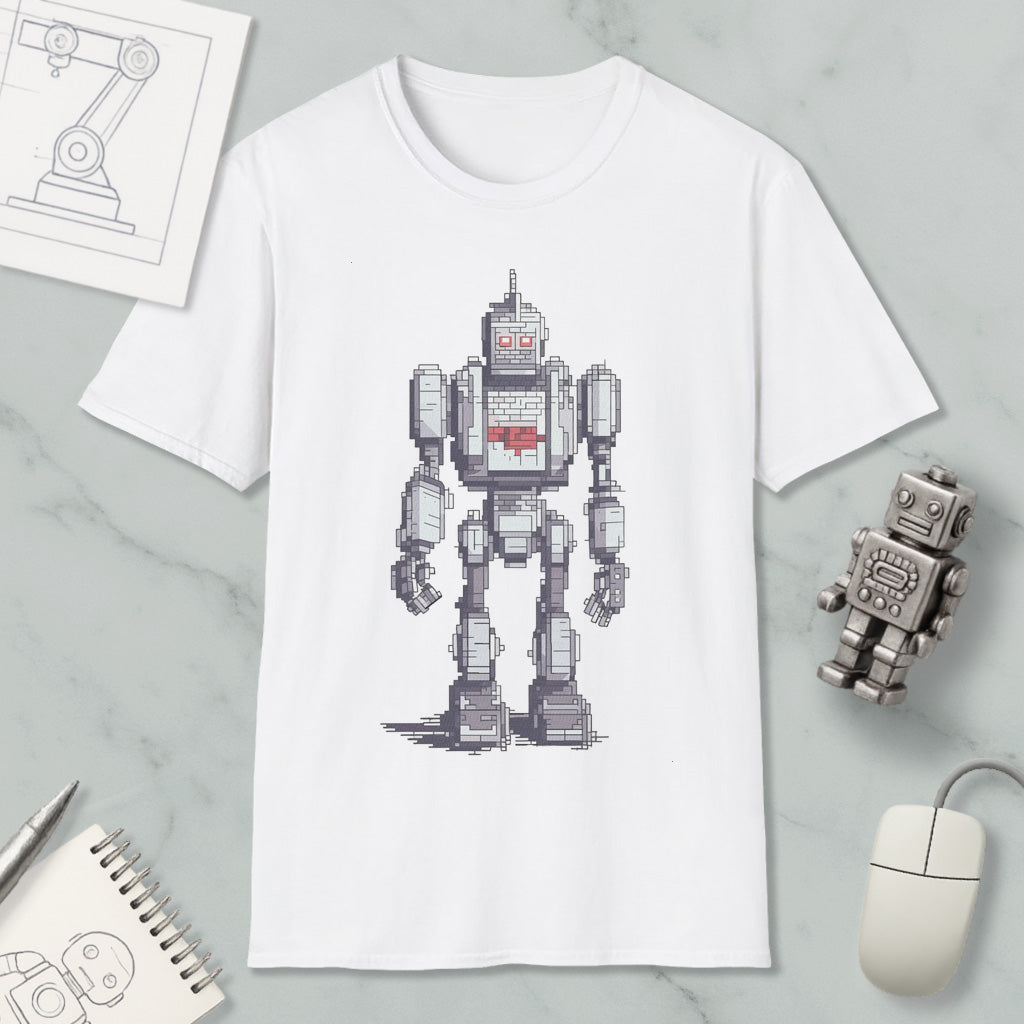 a white t-shirt with a pixelated robot design, along with various objects such as a computer mouse, a notebook, and a pen.