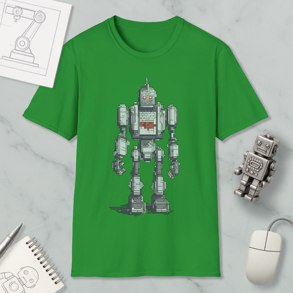 a green t-shirt with a pixelated robot design, along with a computer mouse, a notebook, and a pen on a marble surface.