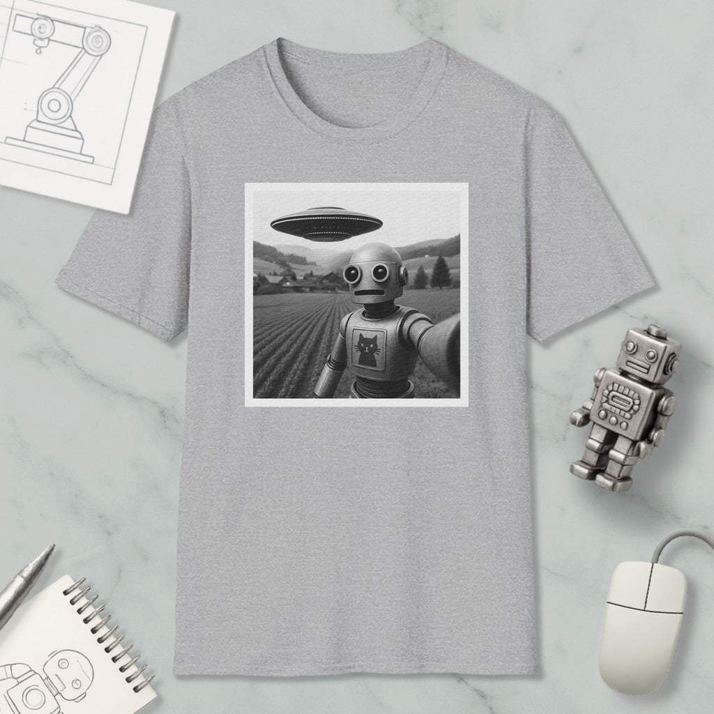 a gray t-shirt with a black and white photo of a robot, a small robot, and a computer mouse on a marble surface.