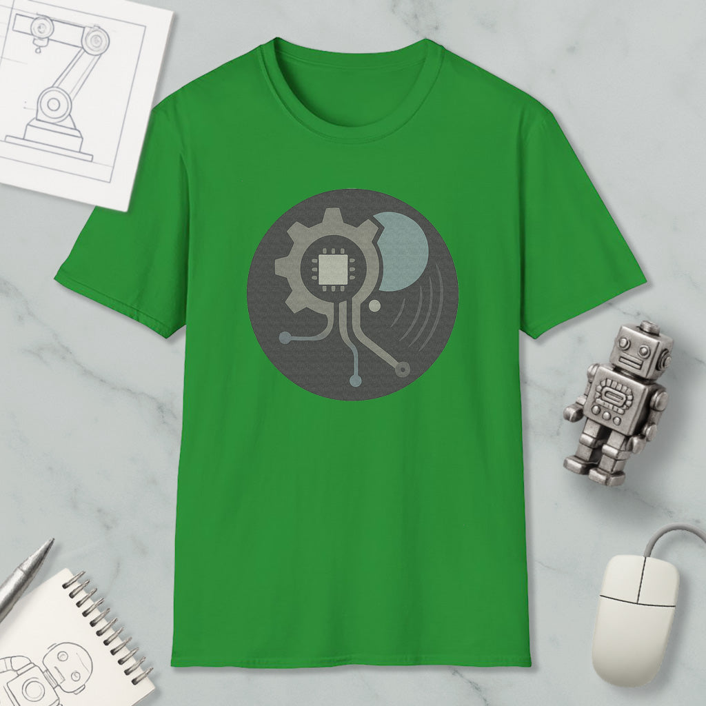 a green t-shirt with a graphic design, a small robot, a computer mouse, and a notebook on a marble surface.