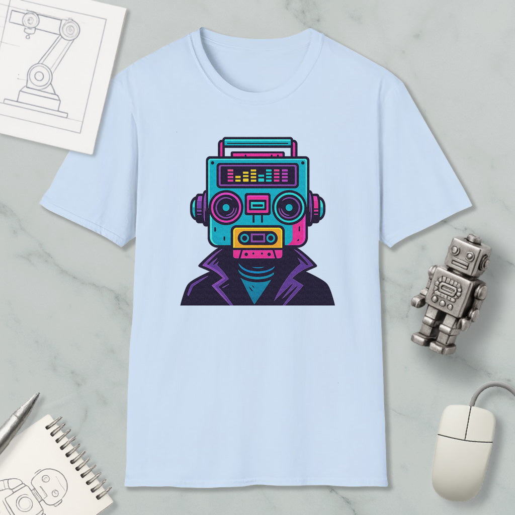 a light blue t-shirt with a colorful graphic of a robot or robot-like figure on it, along with various objects such as a computer mouse, a notebook, and a pen.