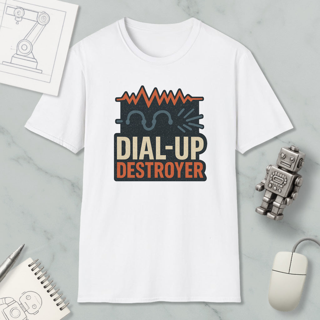 a white t-shirt with a graphic design, a computer mouse, a notebook, and a small robot on a marble surface.
