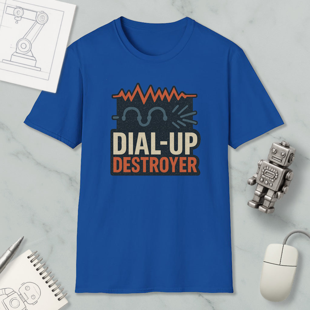 a blue t-shirt with a graphic design, a computer mouse, a notebook, and a small robot on a marble surface.