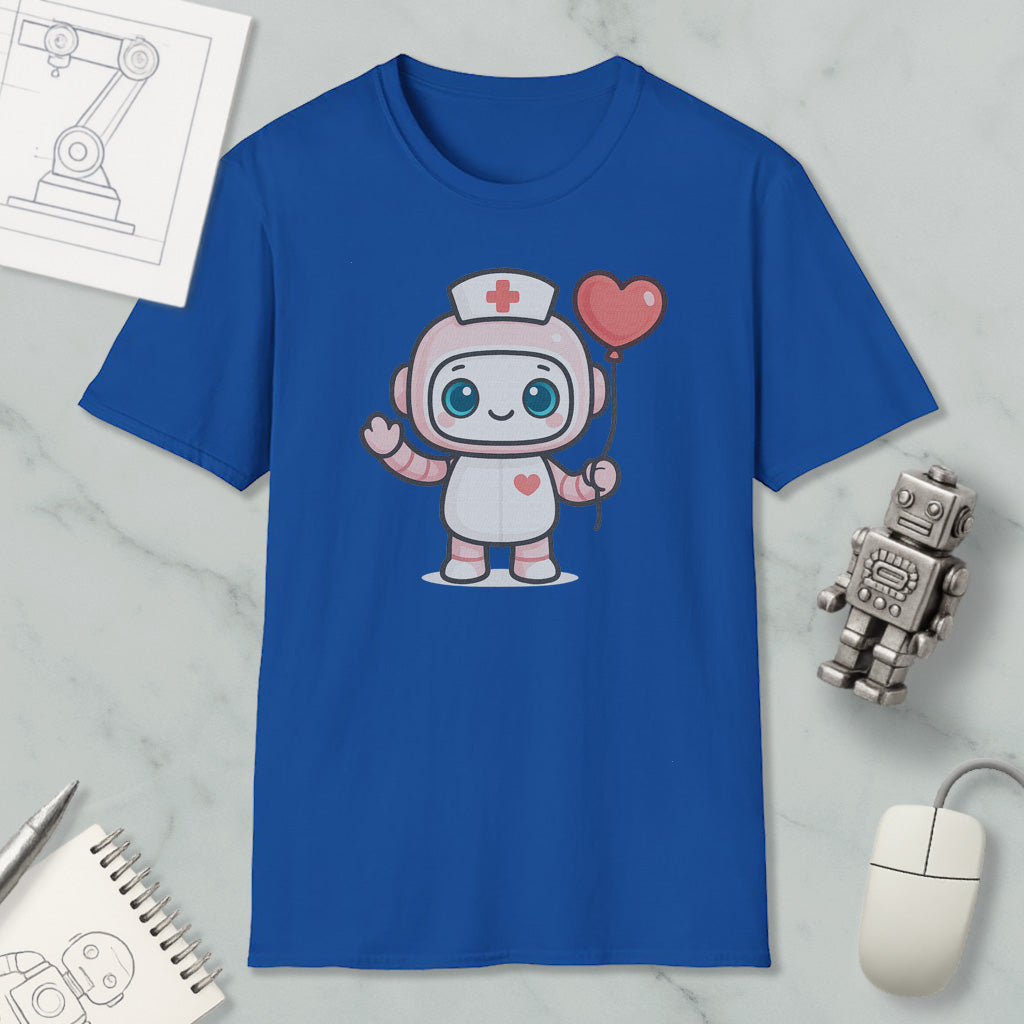 a blue t-shirt with a cartoon robot character wearing a nurse's hat and holding a heart-shaped balloon. The t-shirt is displayed on a marble surface, along with a computer mouse, a notebook, and a small robot figurine.