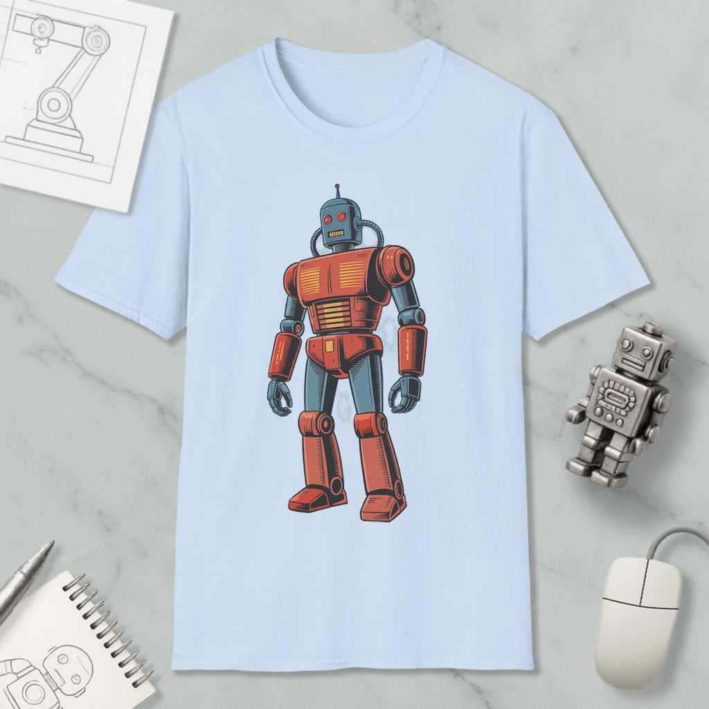 a light blue t-shirt with a red and blue robot graphic printed on it, along with various objects such as a computer mouse, a notebook, and a pen.
