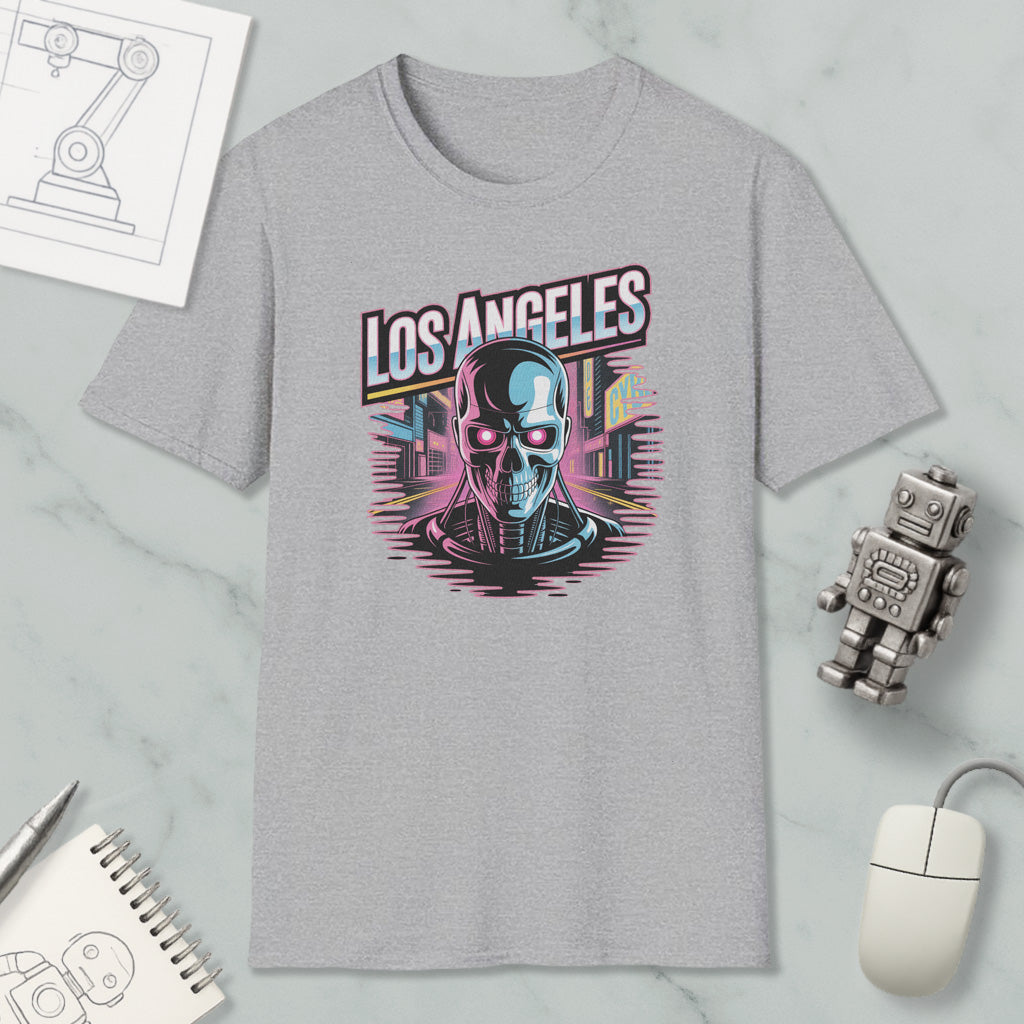 a gray t-shirt with a graphic design of a skull and cityscape, along with various office supplies and a computer mouse.