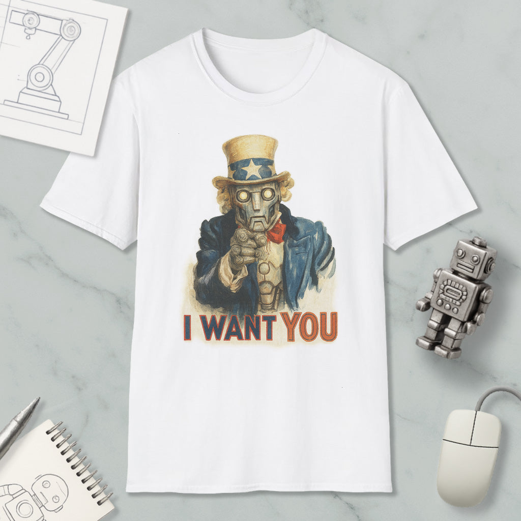 a white t-shirt with a graphic design of a robot character and the text "I WANT YOU" printed on it. The t-shirt is placed on a marble surface, along with a computer mouse, a pen, and a notebook.