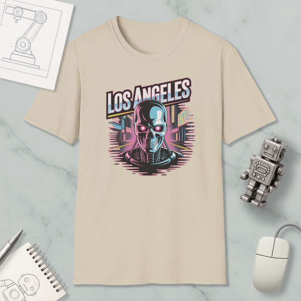 a beige t-shirt with a graphic design of a skull and cityscape, along with various objects such as a computer mouse, a notebook, and a robot.