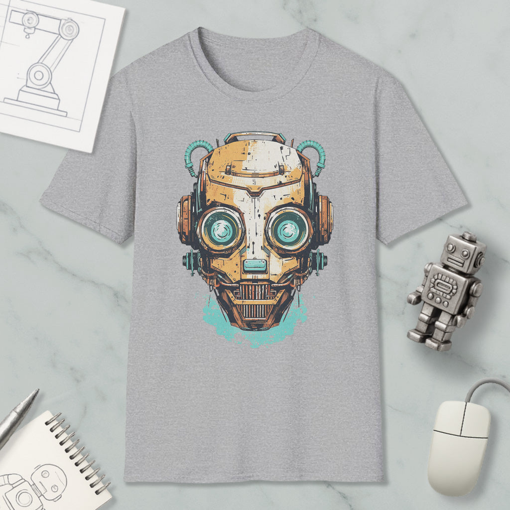 a gray t-shirt with a graphic design of a robot or cyborg head, along with various objects such as a computer mouse, a notebook, and a pen.