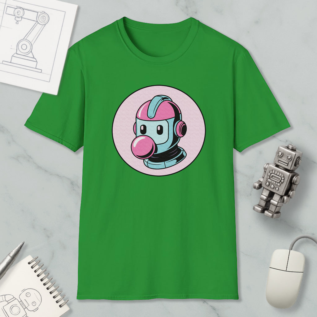 a green t-shirt with a cartoon robot design, along with various objects such as a mouse, a notebook, and a pen.