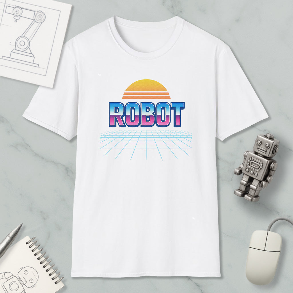 a white t-shirt with a graphic design of a robot and a sun-like shape, along with a computer mouse and a notebook.