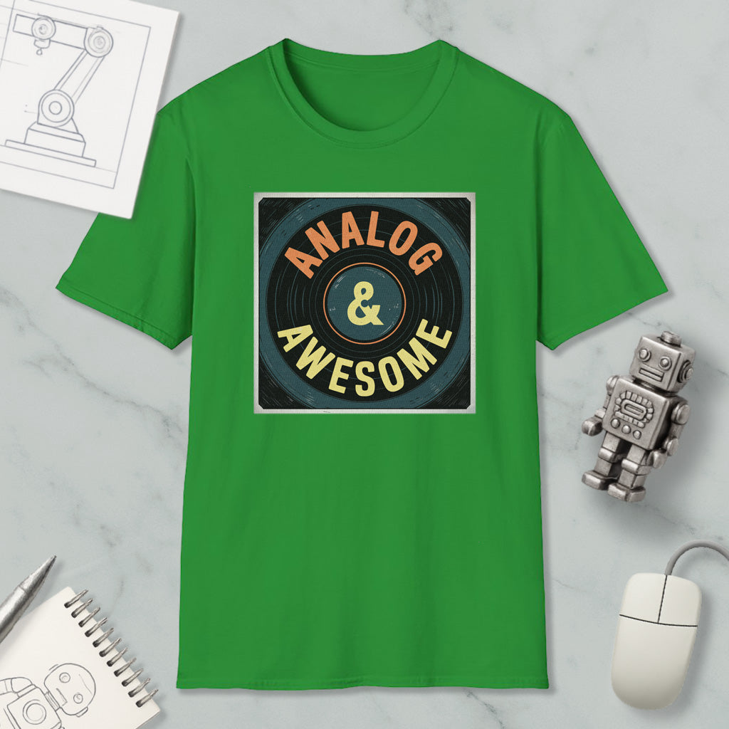 a green t-shirt with a graphic design that says "ANALOG & AWESOME" on it, along with a small robot and a computer mouse.