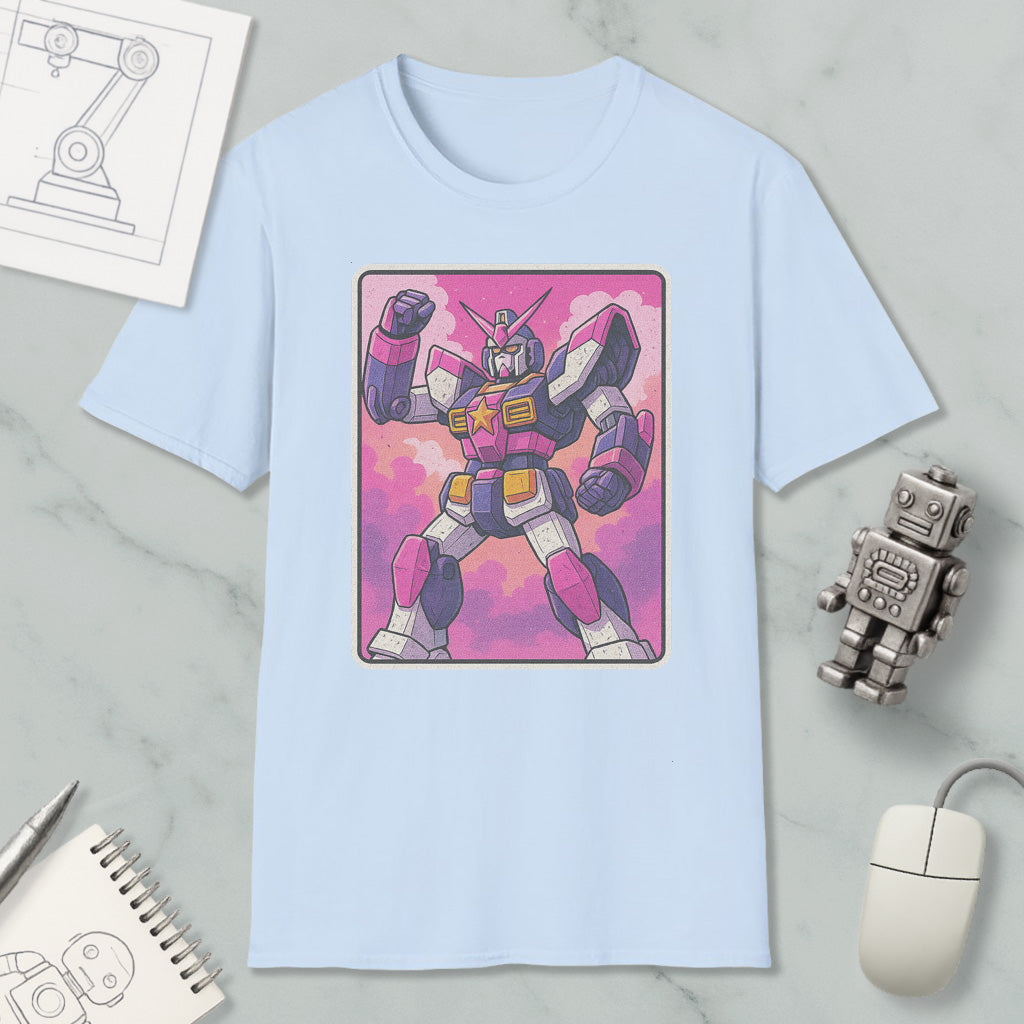 a light blue t-shirt with a graphic of a pink and purple robot or character, along with various objects such as a computer mouse, a notebook, and a robot figurine.