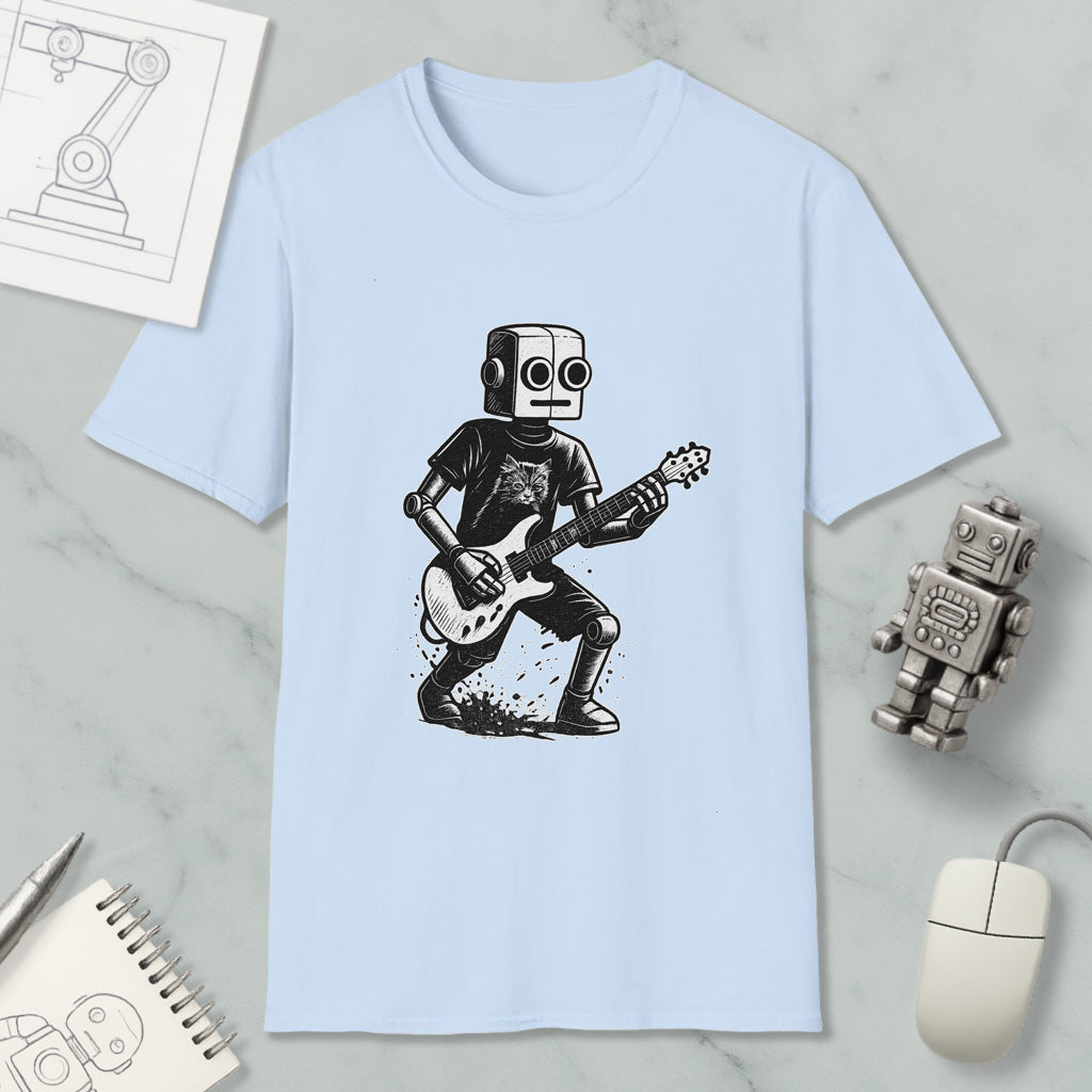 A light blue t-shirt with a graphic of a robot playing a guitar, accompanied by a computer mouse, a notebook, and a sketch of a robot.