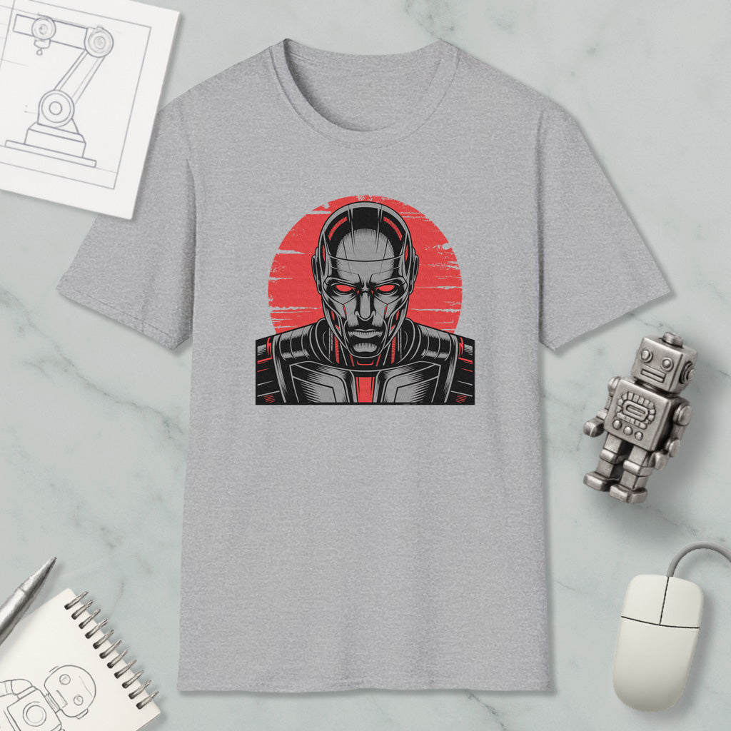 a gray t-shirt with a graphic design depicting a robot or cyborg-like figure, along with various office supplies and a computer mouse.