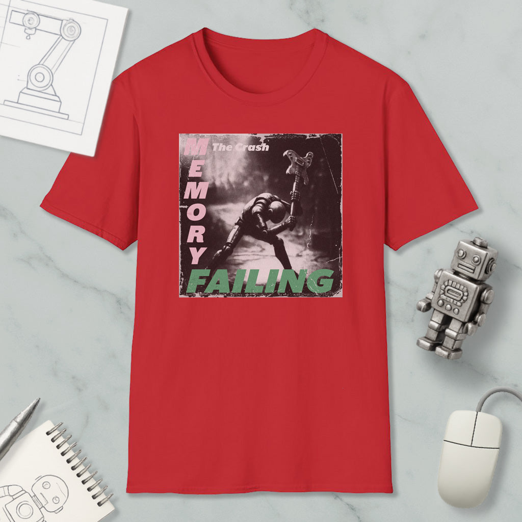 a red t-shirt with a graphic design depicting a person in a robot-like pose, accompanied by the text "The crash memory failing".