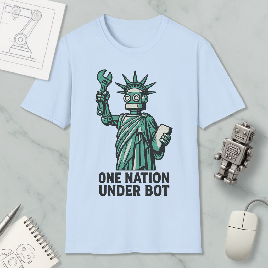 A light blue t-shirt with a graphic design depicting a robot figure holding a wrench and a tablet, accompanied by the text "ONE NATION UNDER BOT".