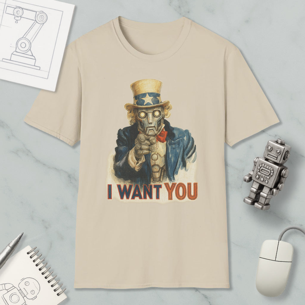 a t-shirt with a graphic design of a robot character and the text "I WANT YOU" printed on it. The t-shirt is placed on a marble surface, along with a computer mouse, a pen, and a notebook.