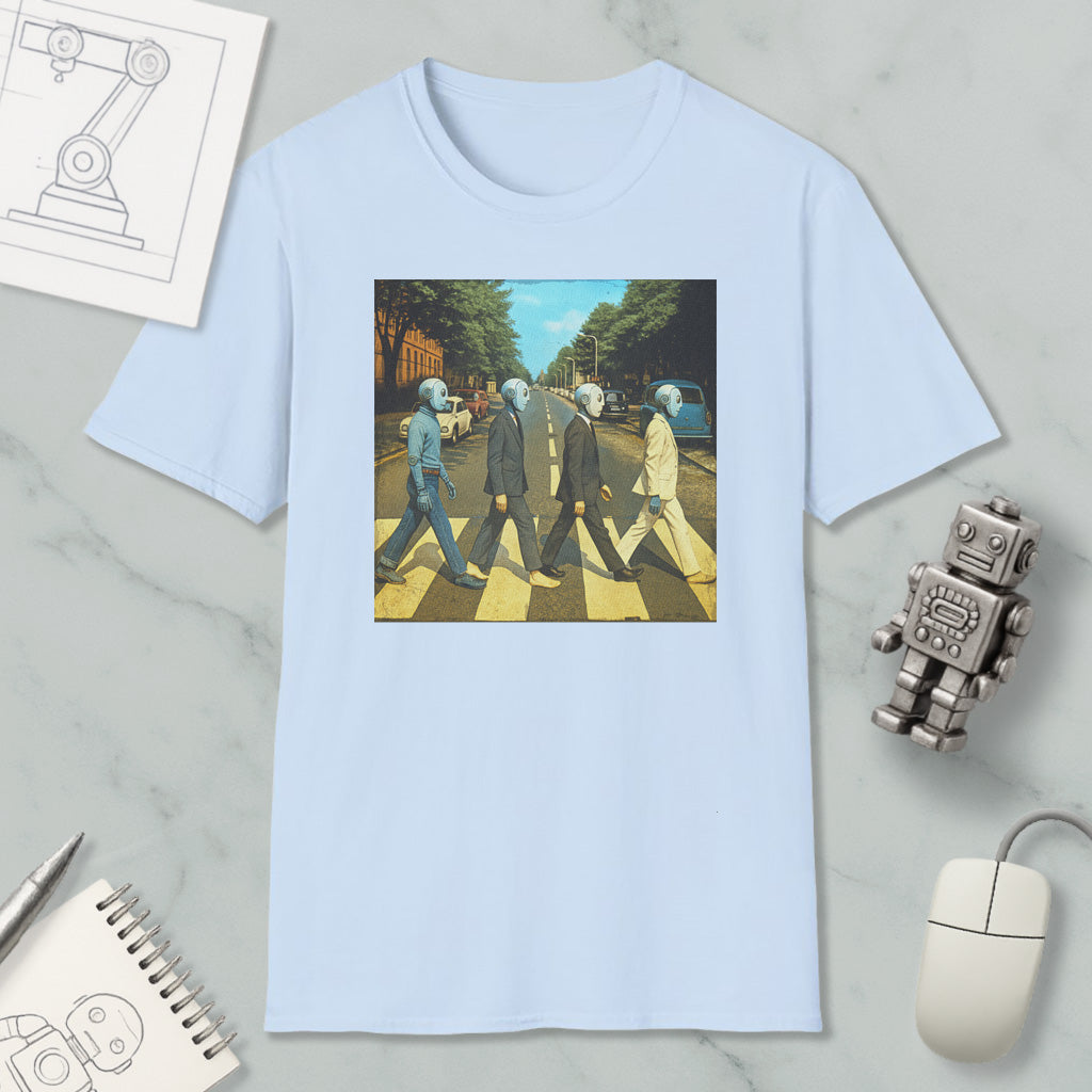 a light blue t-shirt with a graphic design depicting four people walking on a crosswalk, with one person wearing a suit and tie.
