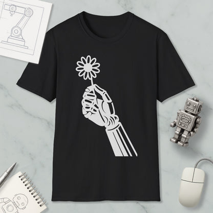 a black t-shirt with a white graphic design depicting a hand holding a flower, along with a computer mouse, a notebook, and a robot figurine.
