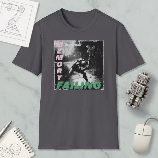 a gray t-shirt with a graphic design depicting a person in a dark environment, surrounded by various objects such as a robot, a mouse, and a notebook.