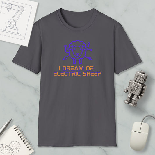 a gray t-shirt with a graphic design and text, along with a small robot and a mouse, all placed on a marble surface.