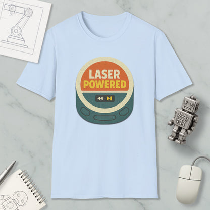 a light blue t-shirt with a graphic design that says "LASER POWERED" in bold letters. The t-shirt is placed on a marble surface, surrounded by various objects such as a computer mouse, a pen, a notebook, and a small robot.
