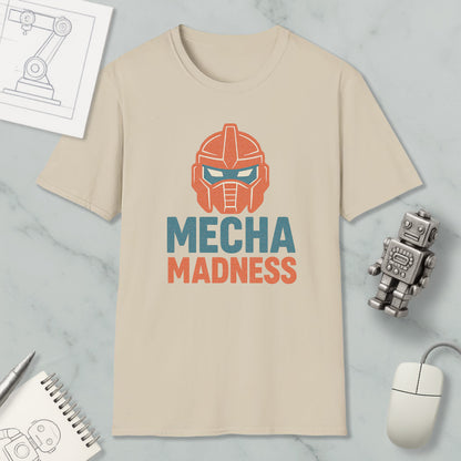 a beige t-shirt with a graphic design of a robot's head and the text "MECHA MADNESS" printed on it, along with a computer mouse and a notebook.
