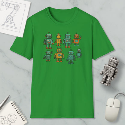 a green t-shirt with a graphic of eight colorful robots, along with a computer mouse and a notebook on a marble surface.