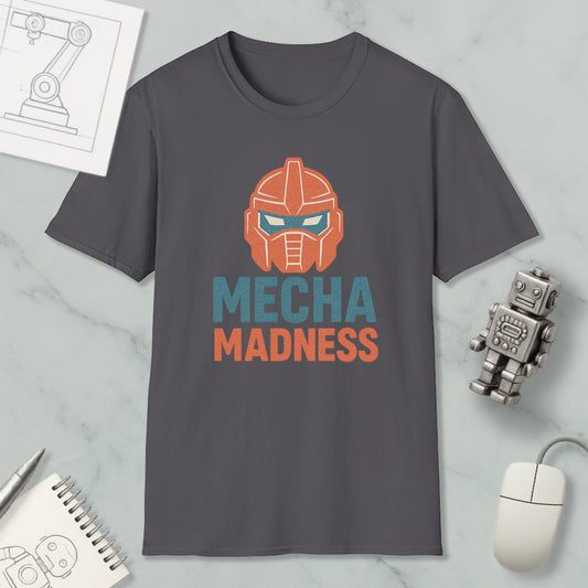 a gray t-shirt with a graphic design of a robot's head and the text "MECHA MADNESS" printed on it, along with a computer mouse and a notebook.