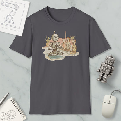 a gray t-shirt with a cartoon illustration of a robot sitting in a meditative pose, surrounded by three smaller figures, likely representing humans. The t-shirt is displayed on a marble surface, along with a computer mouse, a notepad, and a small robot figurine.