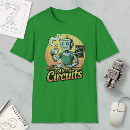 a green t-shirt with a graphic design of a robot holding a cup of coffee and a sign that says "Coffee & Circuits". The t-shirt is displayed on a marble surface, along with a computer mouse, a notebook, and a small robot figurine.