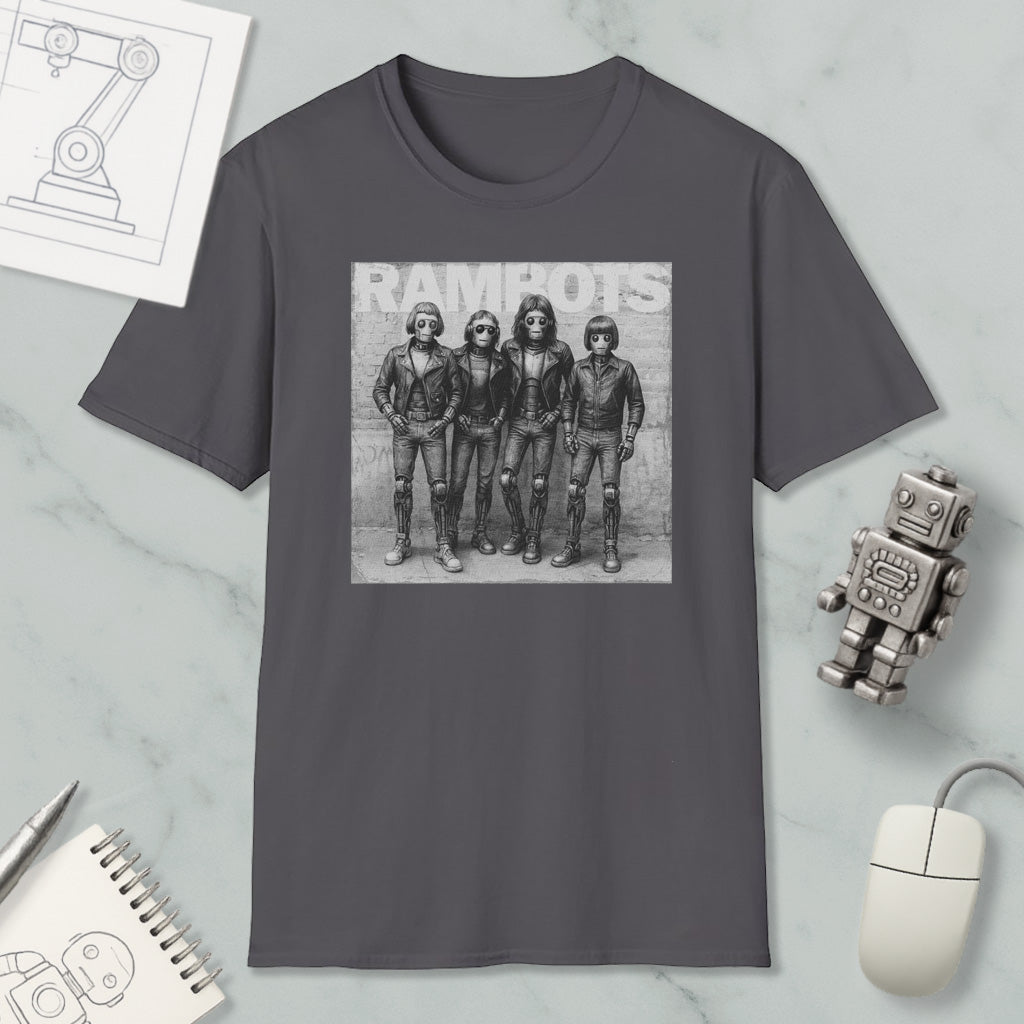 a gray t-shirt with a black and white photograph of four people, likely representing the members of a band, along with a computer mouse and other office supplies.