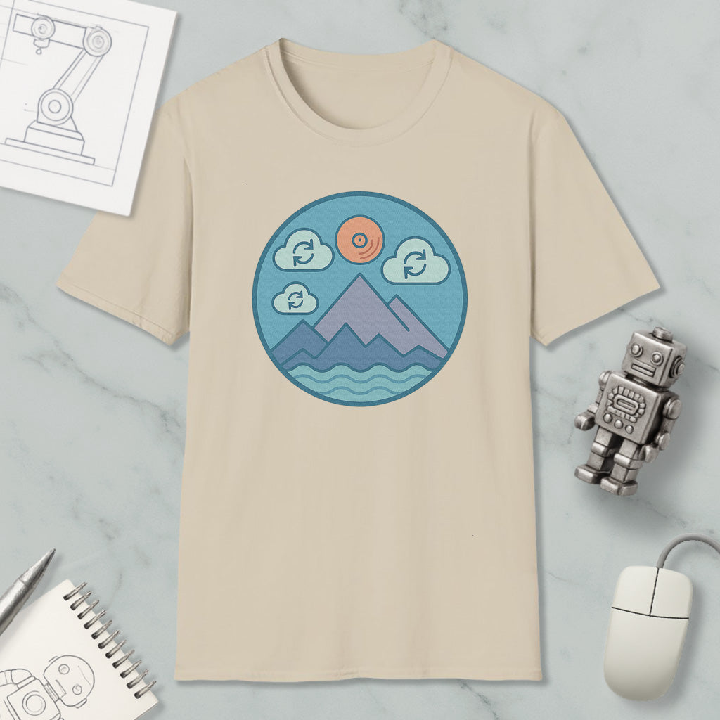 a beige t-shirt with a circular graphic design depicting mountains, clouds, and a sun, along with a robot and a computer mouse.