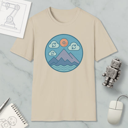 a beige t-shirt with a circular graphic design depicting mountains, clouds, and a sun, along with a robot and a computer mouse.