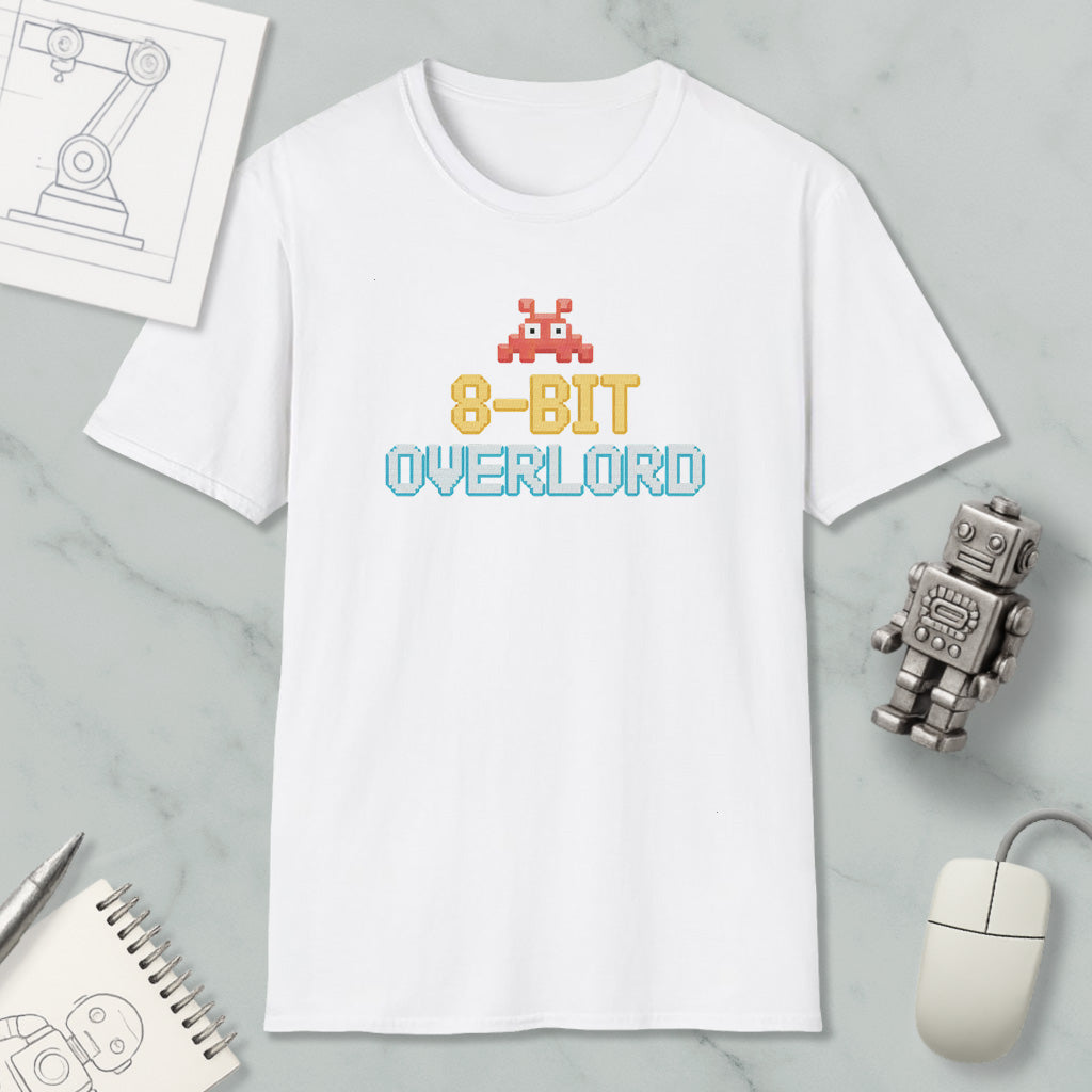 a white t-shirt with a graphic design, a computer mouse, a robot, and some technical drawings on a marble surface.