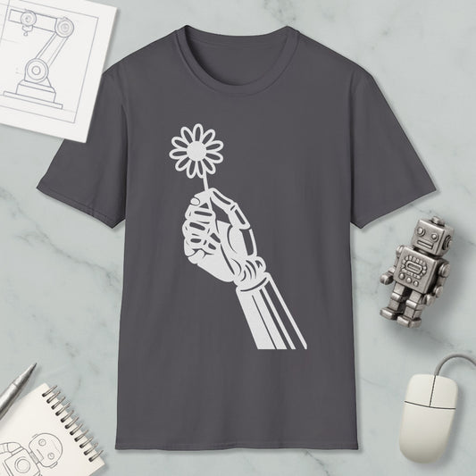 a gray t-shirt with a white graphic design depicting a hand holding a flower, along with a computer mouse, a notebook, and a small robot figurine.