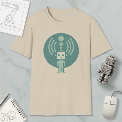 a beige t-shirt with a graphic design of a robot, a mouse, and a notebook on a marble surface.