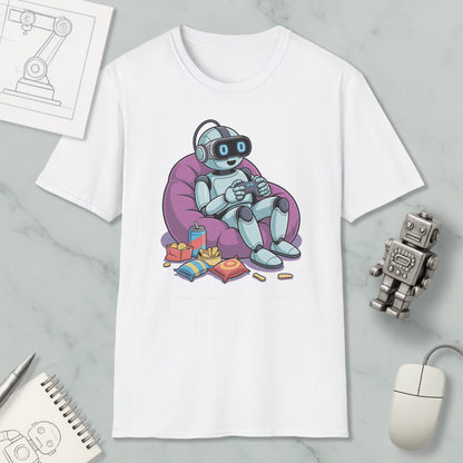 A white t-shirt with a cartoon robot sitting in a bean bag chair, holding a remote control, surrounded by snacks and a toy robot.