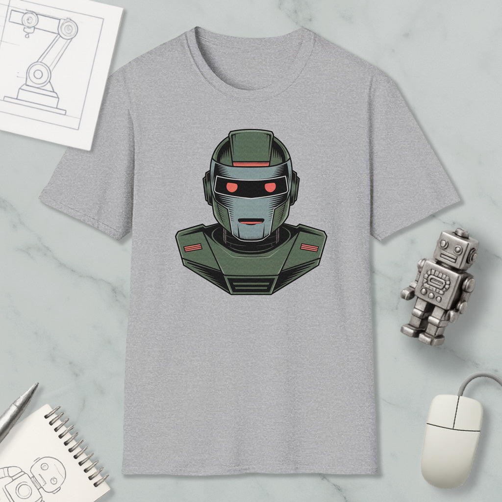a gray t-shirt with a graphic of a robot or robot-like character, along with various objects such as a computer mouse, a notebook, and a pen.