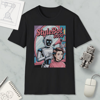 a black t-shirt with a graphic design depicting a robot hairdresser styling a woman's hair. The robot is holding a hairdryer and is positioned in front of a mirror. The design also includes a text overlay that reads "StyleBot 3000".