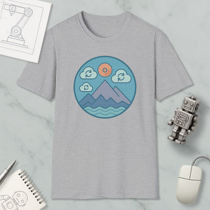 a gray t-shirt with a circular graphic design depicting mountains, clouds, and a sun, along with a robot and a computer mouse.