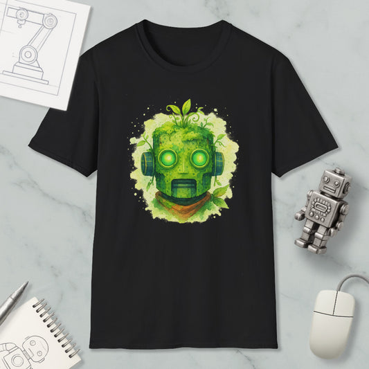 a black t-shirt with a green robot-like face design, surrounded by various objects such as a computer mouse, a notebook, and a small robot figurine.