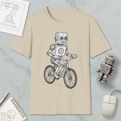 a beige t-shirt with a graphic of a robot riding a bicycle, along with various objects such as a computer mouse, a notebook, and a pen.