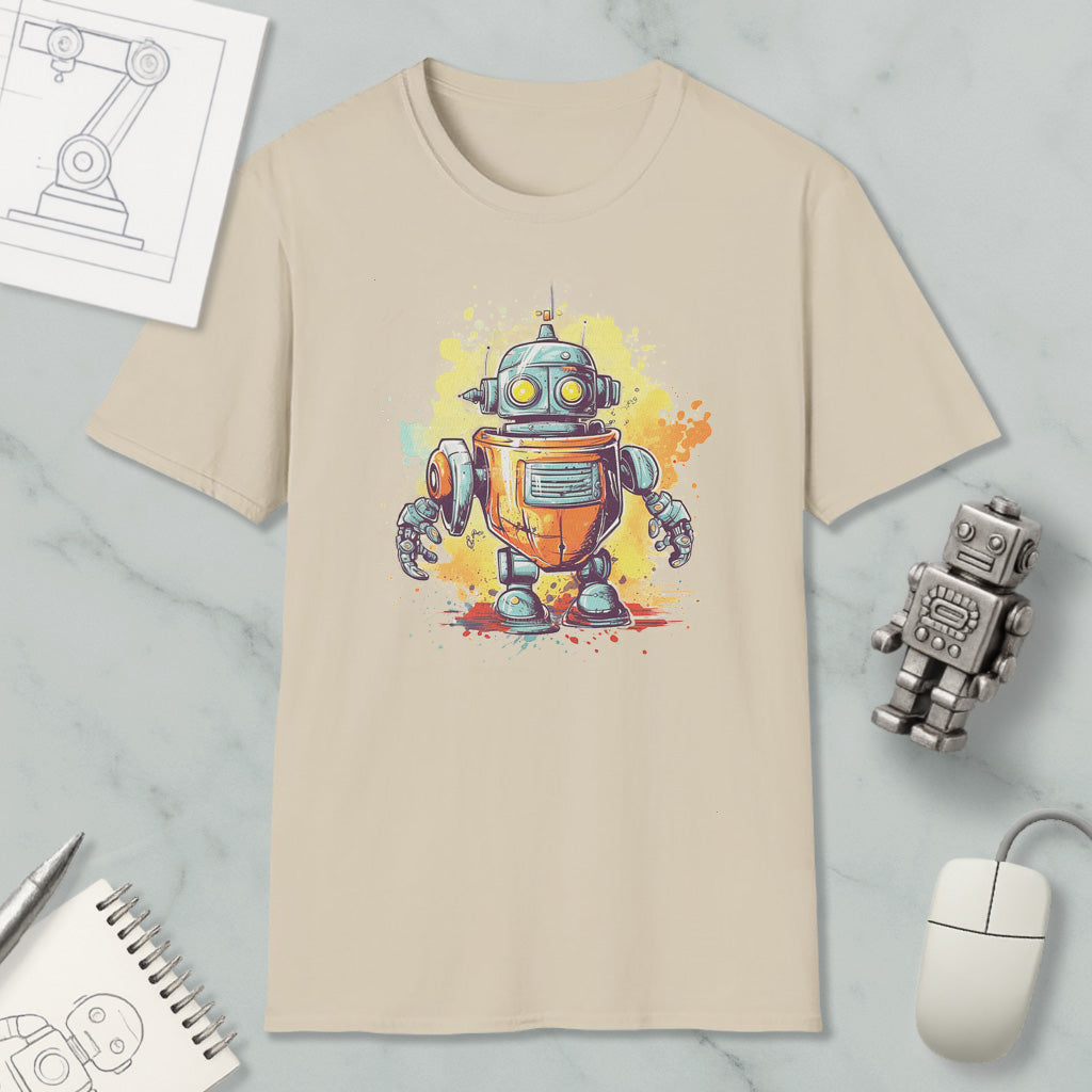 a beige t-shirt with a colorful illustration of a robot, along with various objects such as a computer mouse, a pen, and a notebook.
