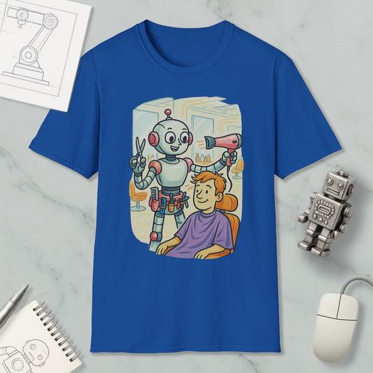 A blue t-shirt with an illustration of a robot giving a haircut to a person, accompanied by a robot toy and a computer mouse.
