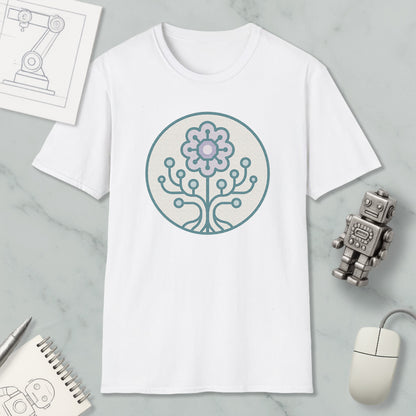 a white t-shirt with a graphic design of a flower and a tree on it, along with a computer mouse, a notebook, and a robot figurine.
