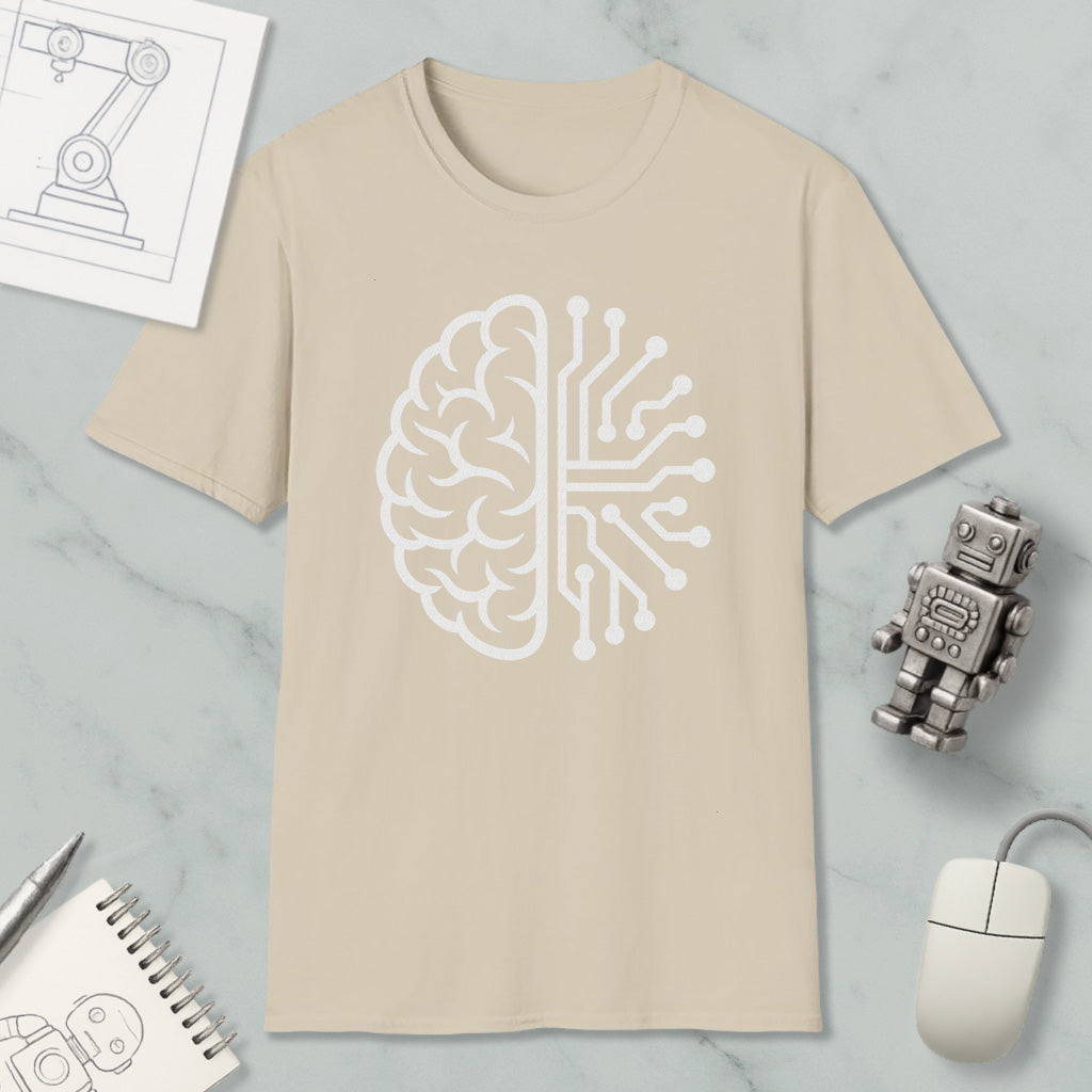 a beige t-shirt with a white graphic design depicting a brain and a circuit board, along with various objects such as a robot, a mouse, and a notebook.