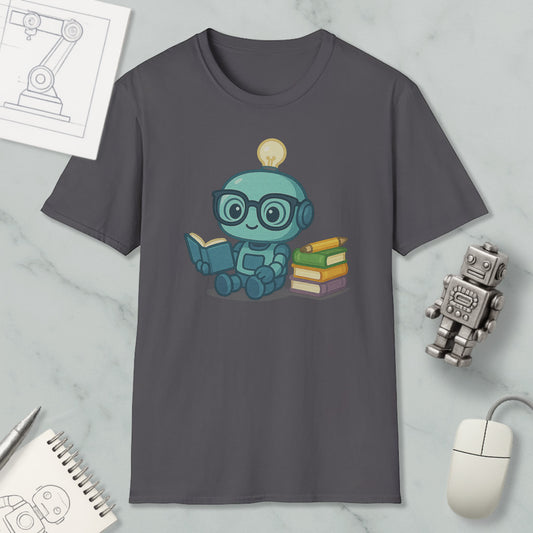 a gray t-shirt with a cartoon robot sitting and reading a book, surrounded by various objects such as a computer mouse, a notebook, and a stack of books.