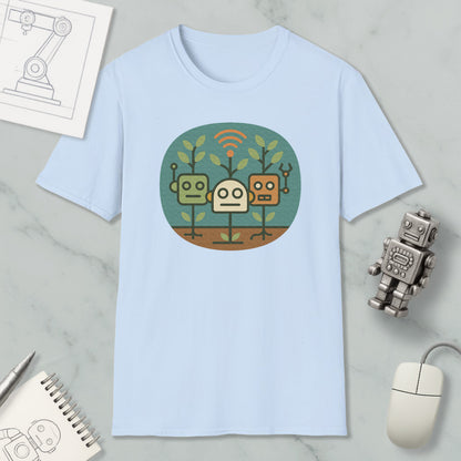 a light blue t-shirt with a graphic design of three cartoon robots, along with various objects such as a computer mouse, a notebook, and a pen.